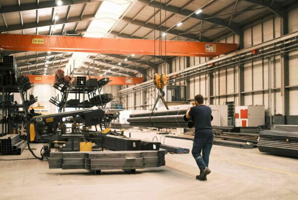Overhead bridge crane and industrial equipment on the floor of a manufacturing facility in Atlanta