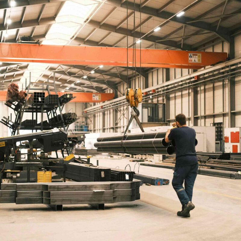 Overhead bridge crane and industrial equipment on the floor of a manufacturing facility in Atlanta