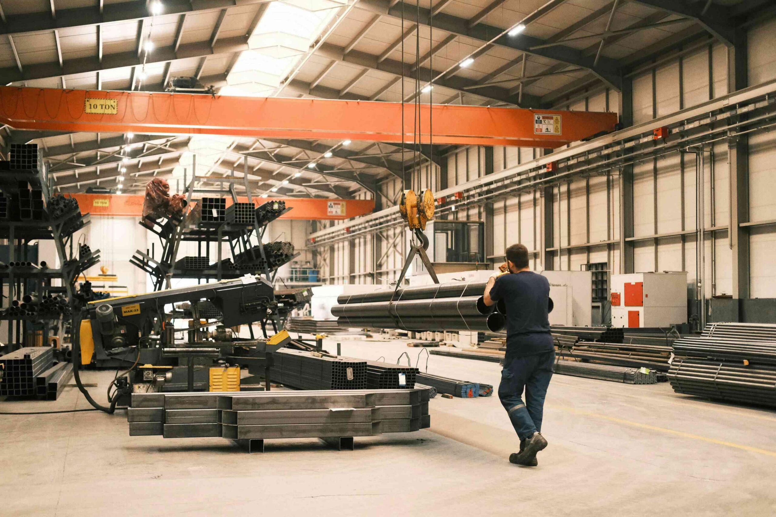 Overhead bridge crane and industrial equipment on the floor of a manufacturing facility in Atlanta