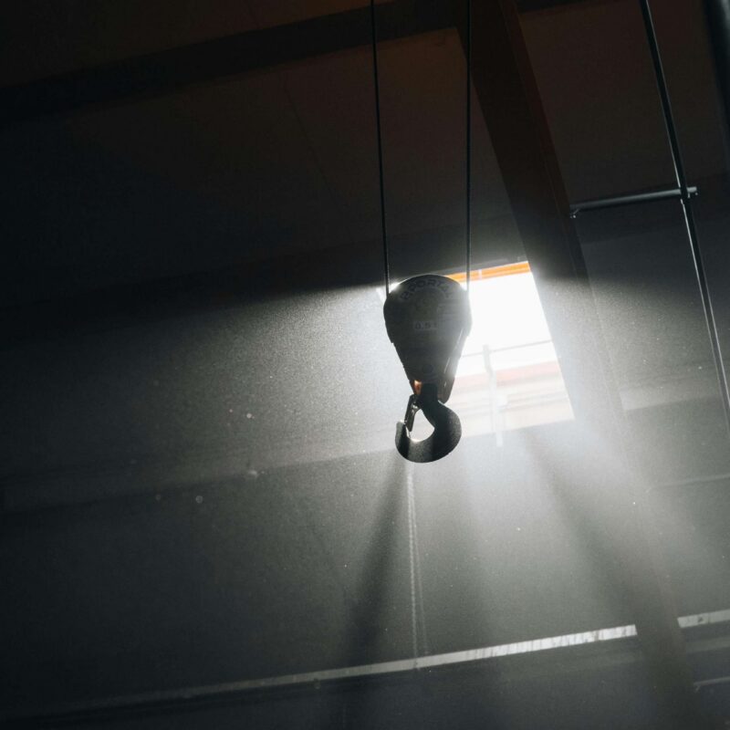 Industrial overhead crane hook inside a manufacturing facility — rigging services in Atlanta by RigX