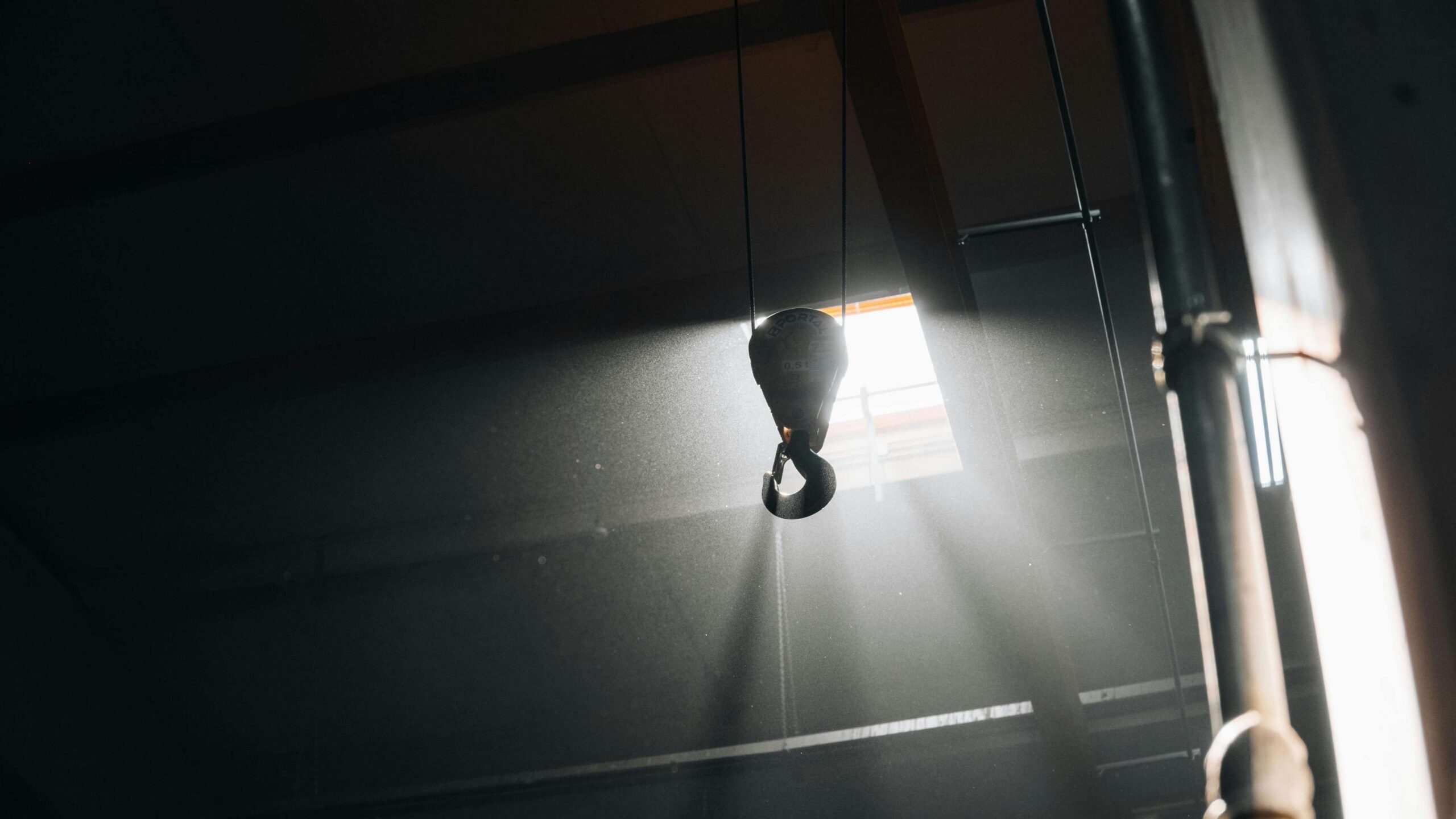 Industrial overhead crane hook inside a manufacturing facility — rigging services in Atlanta by RigX